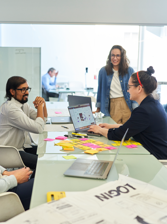 nventive Design team discussing project strategies in a meeting.