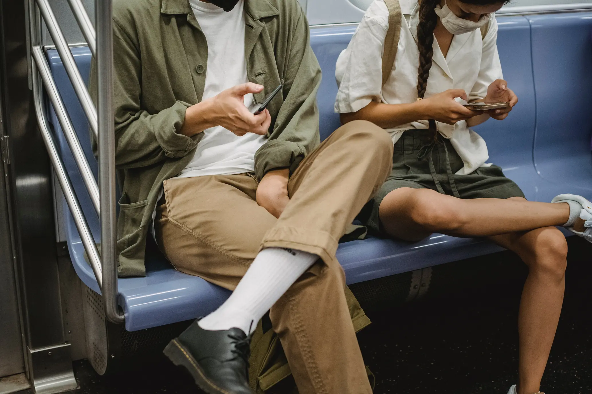 People checking their phones in public transport